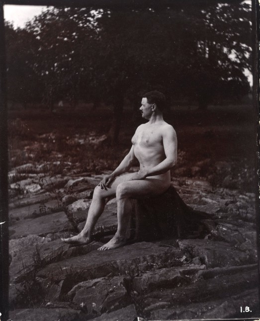 L0034532 A man posing naked, seated on a rocky Credit: Wellcome Library, London. Wellcome Images images@wellcome.ac.uk http://wellcomeimages.org A man posing naked, seated on a rocky outcrop in a leafy landscape. Photograph ca. 1900 Published:  -  Copyrighted work available under Creative Commons Attribution only licence CC BY 4.0 http://creativecommons.org/licenses/by/4.0/